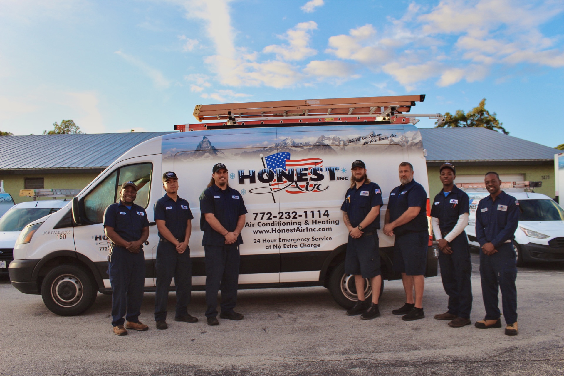 Honest Air technicians in front of a service truck